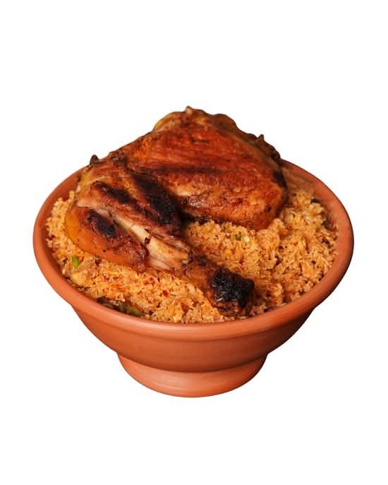 Chicken String Hoppers Kottu in a clay bowl topped with grilled chicken